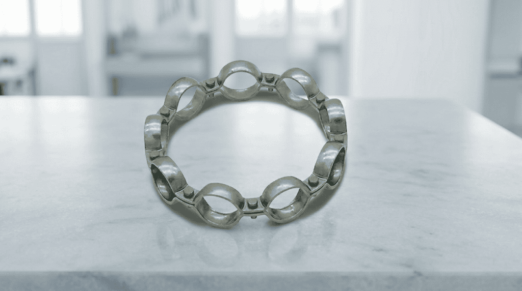 Komponen cage atau retainer bearing yang berfungsi sebagai pemisah elemen gelinding.